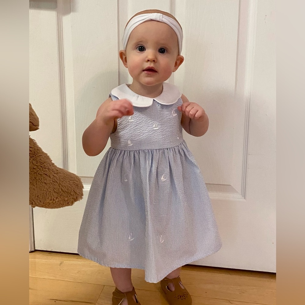 Starting out baby girl dress. Blue seersucker with sailboats. Size 12-18 months